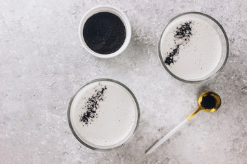 Obraz na płótnie Canvas Black charcoal latte. Detox drink. Selective focus