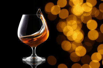 splash of brandy in snifter glass