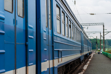 Fototapeta na wymiar Suburban train arrived at some low platform at Ryazan oblast