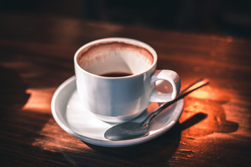 cup of coffee on brown background