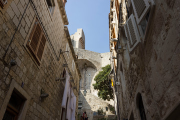 DUBROVNIK, CROATIA - AUDìGUST 22 2017: detail of historic redidential buildings and town walls of Dubrovnik