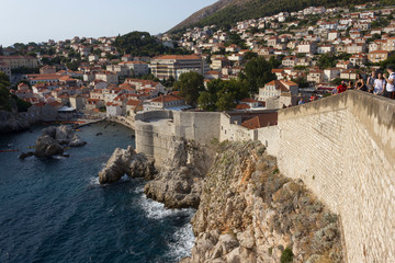 Fototapeta na wymiar DUBROVNIK, CROATIA - AUGUST 22 2018: Overview of the city of Dubrovnik from its ancient walls