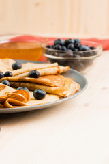 Fresh homemade crepes with blueberry and honey