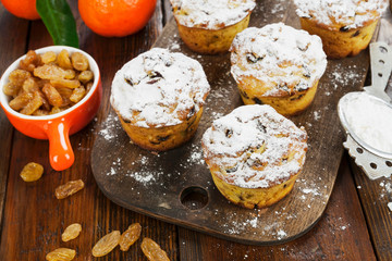 Mandarin muffins with raisins on the table