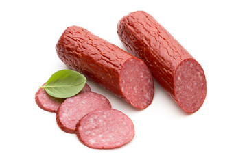Salami smoked sausage, basil leaves on white background cutout.