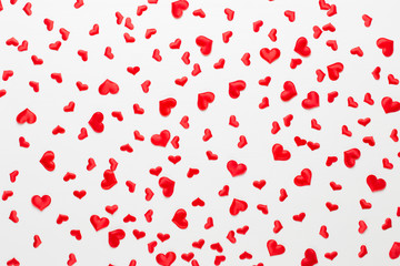 Valentines day background red hearts on wooden background.