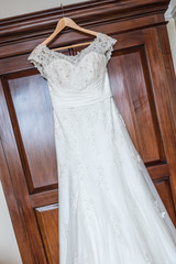 Wedding dress hanging up before the ceremony