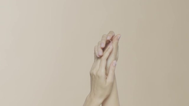 Feminine hands on a beige background, recorded on Red Monstro using the Briese Focus 140 HMI light.