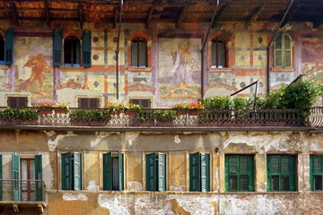 Beautiful Italian fresco on building facade. Piazza Delle Erbe. Verona, Italy