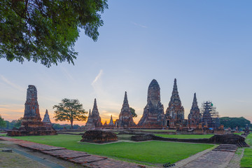 Fototapeta premium Sunrise over Buddhist temple Wat Chaiwatthanaram in Ayuthaya - a UNESCO World Heritage Site, the ancient capital of the Kingdom of Siam, now Thailand.