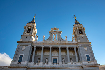 Fototapeta na wymiar The bell tower and dome of the famous Almudena Cathedral, Madrid