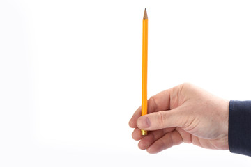 Male hand holds pencil vertically isolated on white background