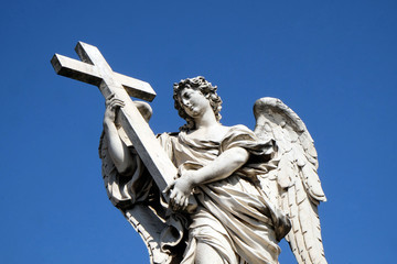 Naklejka premium Statue of Angel with the Cross by Ercole Ferrata, Ponte Sant Angelo in Rome, Italy 
