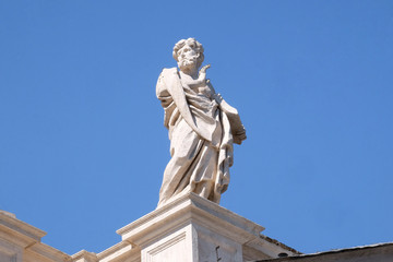 Fototapeta na wymiar St Leonard, fragment of colonnade of St. Peters Basilica. Papal Basilica of St. Peter in Vatican 