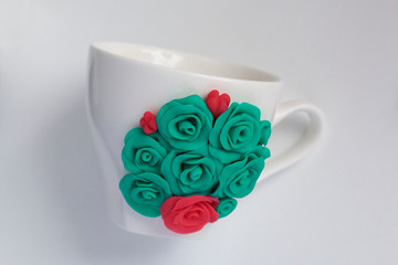 Mug, decorated with flowers made of polymer clay. Crafts from polymer clay. Mug decorated with...