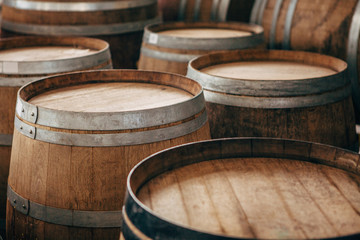 Fototapeta premium Old wooden wine barrels with iron hoops.