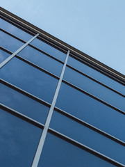 Modern building with glass walls with a sky in the background