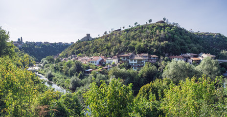 Fototapeta na wymiar Panoramic view of Veliko Tarnovo from Tsarevets hill. Typical terrace architecture in Veliko Tarnovo, Bulgaria