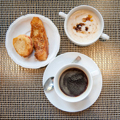 Breakfast with muesli, coffee and toasts, top view