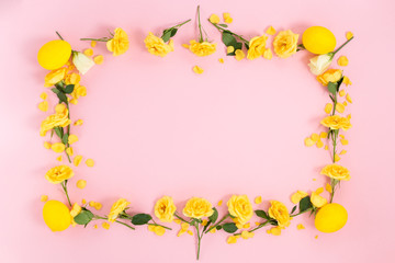 Frame of flowers in the eggs on a pink background. Top view with copy space..