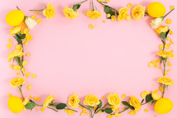 Frame of flowers in the eggs on a pink background. Top view with copy space..
