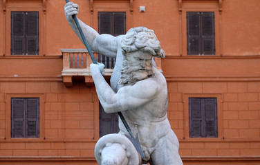 Piazza Navona, Neptune fighting with an octopus statue in the Fountain of Neptune in Rome, Italy © zatletic