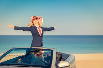 Successful young businesswoman on a beach