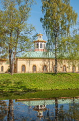Ancient building in the style of a Chinese pagoda on the banks of the river in Alexander Park