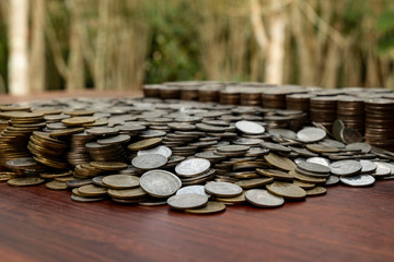 Lots of stack coins on wooden desk, Money for business planning investment and saving concept