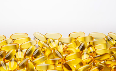  Omega-3 fish fat oil capsules on a white background. 
