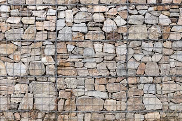 Foto op Plexiglas Steen Keermuur gabion manden, Gabion muur gekooide stenen getextureerde achtergrond