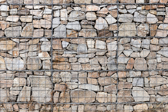 Retaining wall gabion baskets, Gabion wall caged stones textured background