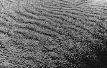 Silver grey fine sand texture background close up copy space