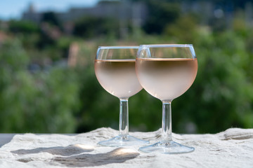 Rose wine of Provence, France, served cold on outdoor terrace in two wine glasses