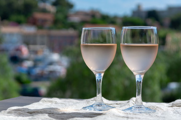 Rose wine of Provence, France, served cold on outdoor terrace in two wine glasses