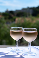 Rose wine of Provence, France, served cold on outdoor terrace in two wine glasses
