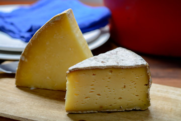 Pieces of French Tomme and Cantal cheese, close up
