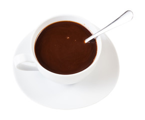 carob powder drink in white cup with spoon
