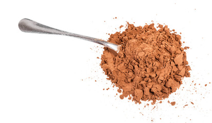 pile of ground carob powder with steel spoon