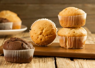 Chocolate cake and nut cake, homemade cakes on wooden background