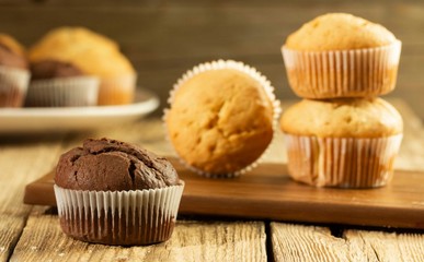 Chocolate cake and nut cake, homemade cakes on wooden background