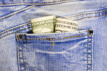 Dollar bill in jeans pocket. Paper money bill.