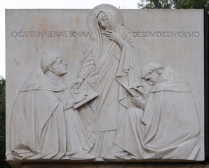 Relief of Saint Catherine of Siena near Sant Angelo Castle in Rome, Italy 