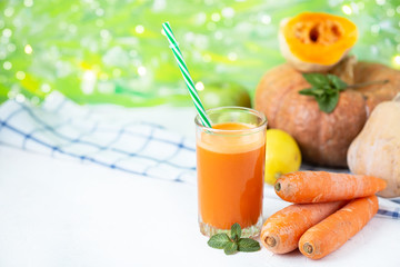 fresh juice from homemade vegetables. Carrot smoothie. Detox, vegetarianism On a bright summer background