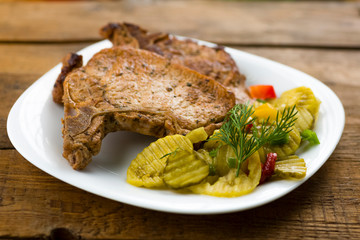 roasted pork chop and salad of cucumbers