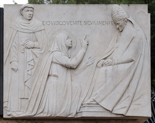 Relief of Saint Catherine of Siena near Sant Angelo Castle in Rome, Italy 