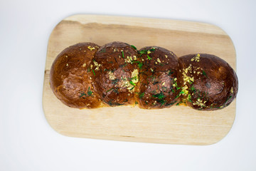 Close-up of freshly baked garlic and herb bread baguette. close-up. view from above. isolate