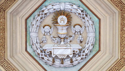 Obraz premium Eucharist chalice and wafer, stucco decoration, basilica of Saint Paul Outside the Walls, Rome, Italy 