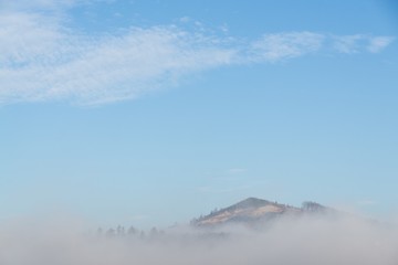 View from mountains with cloudy inversion below. Slovakia