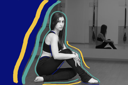 Beautiful slim girl in the gym engaged in fitness, zumba, yoga, pilates, strip dancing. Sports concept. Eastern girl. Caucasian girl.